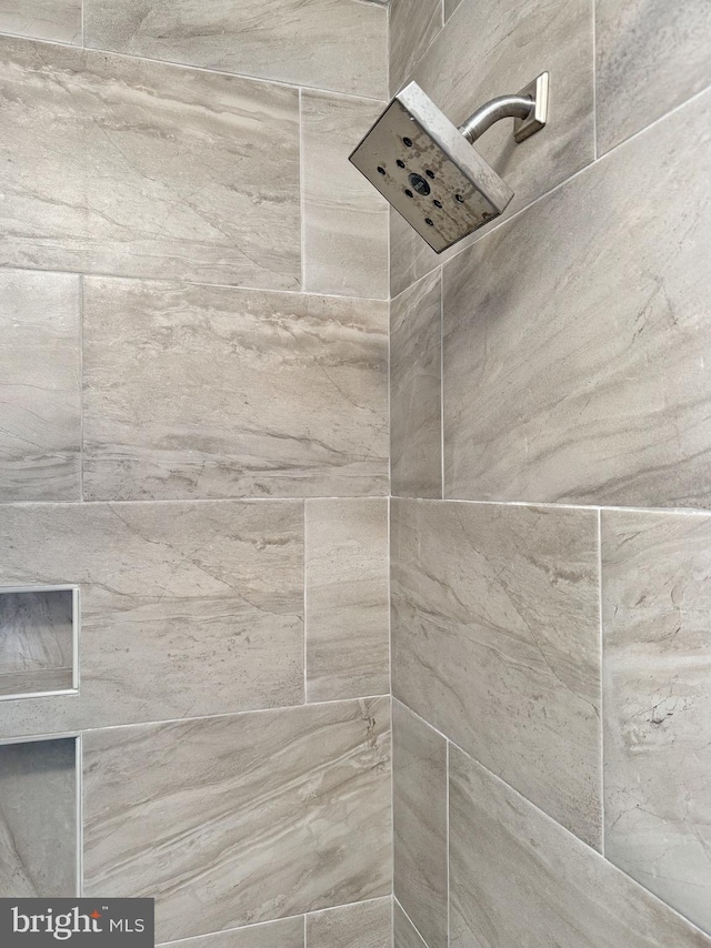 details featuring a tile shower