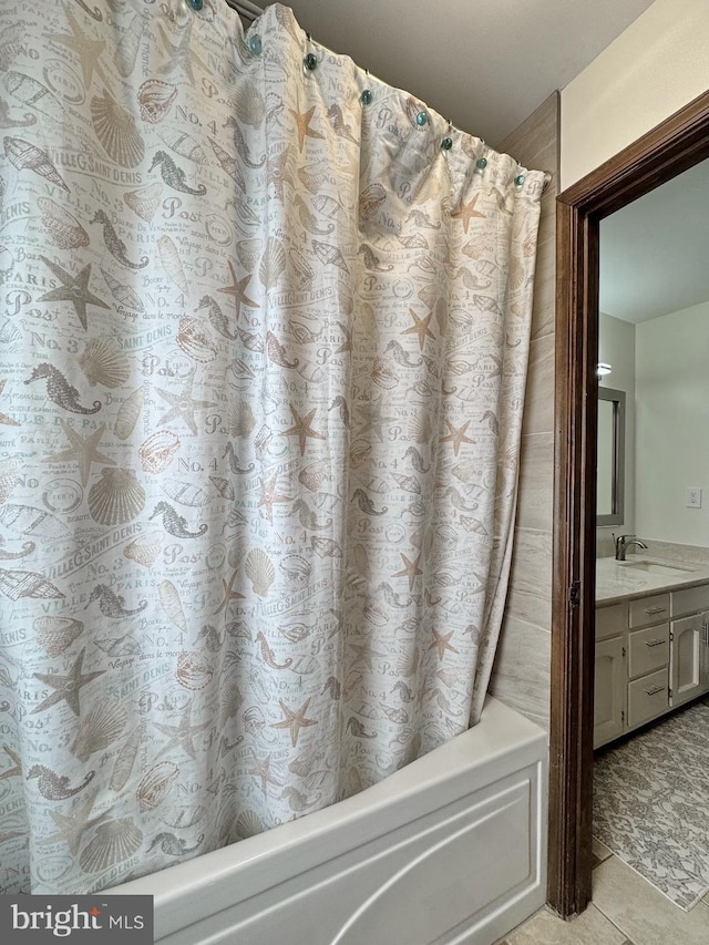 bathroom with vanity, tile patterned floors, and shower / tub combo