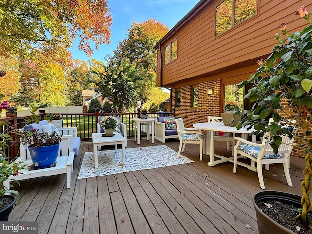 wooden deck featuring an outdoor living space