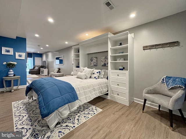 bedroom featuring visible vents, recessed lighting, baseboards, and light wood-style floors