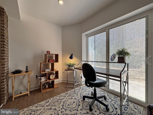 office area featuring wood finished floors and baseboards