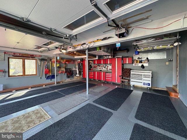 garage featuring a workshop area and a garage door opener