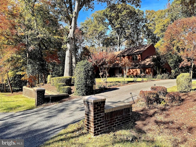 exterior space featuring curved driveway