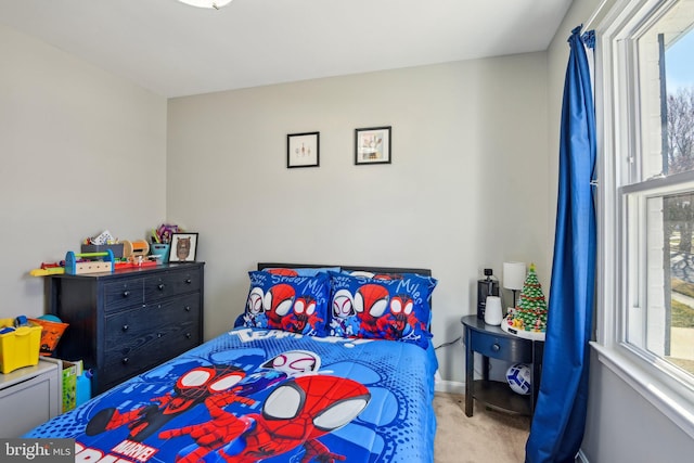 bedroom featuring carpet flooring and baseboards