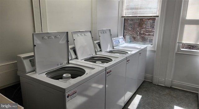 shared laundry area featuring washing machine and dryer