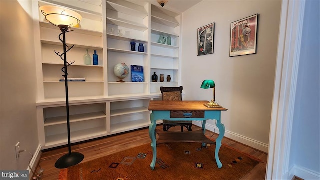 office area featuring wood finished floors and baseboards