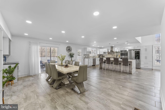 dining space with recessed lighting