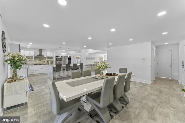 dining area with recessed lighting and baseboards