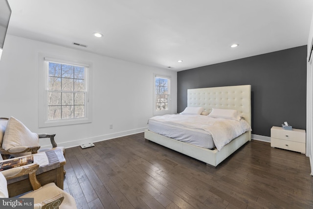 bedroom featuring dark wood finished floors, recessed lighting, baseboards, and visible vents