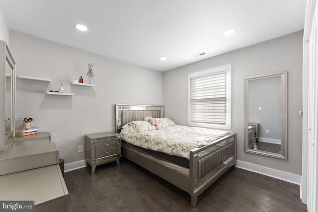 bedroom featuring dark wood finished floors, recessed lighting, baseboards, and visible vents