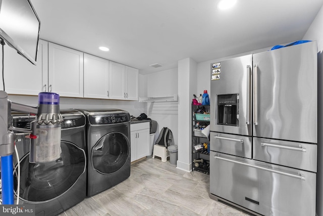 laundry area with washer and clothes dryer, laundry area, and recessed lighting