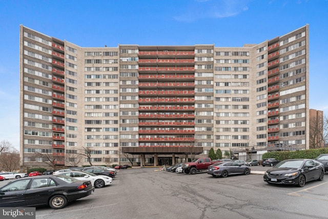 view of property featuring uncovered parking