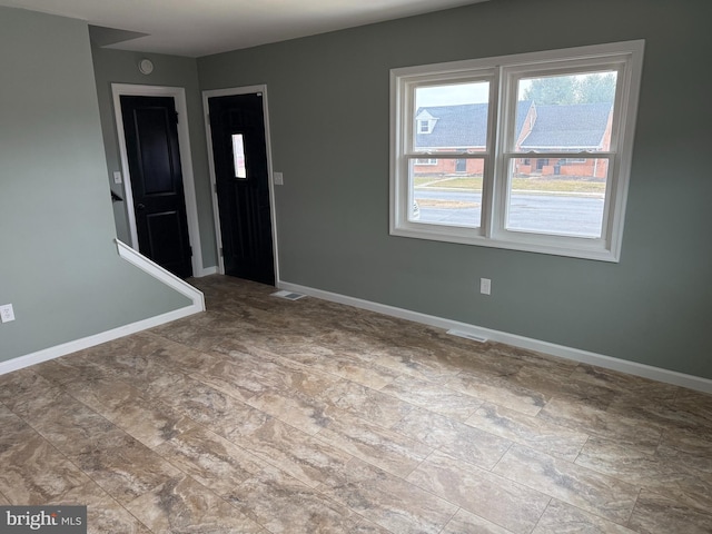 foyer entrance with baseboards