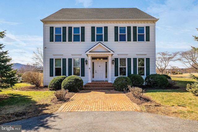 view of front of home featuring a shingled roof