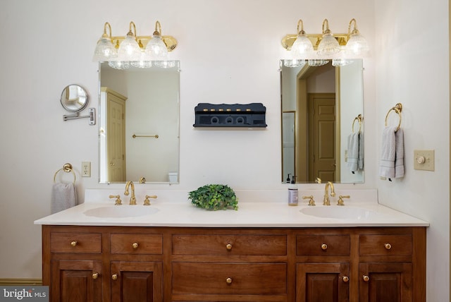 bathroom with a sink and double vanity