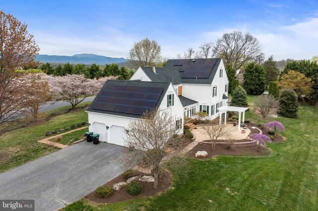 drone / aerial view featuring a mountain view