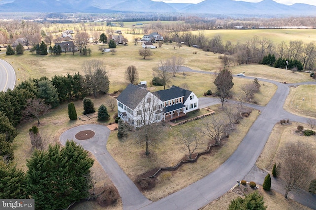 birds eye view of property featuring a rural view and a mountain view