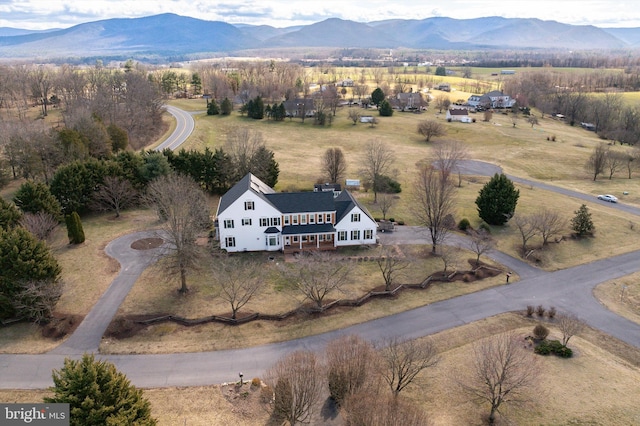 drone / aerial view with a mountain view and a rural view