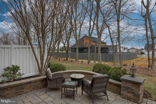 view of patio with a residential view and a fenced backyard