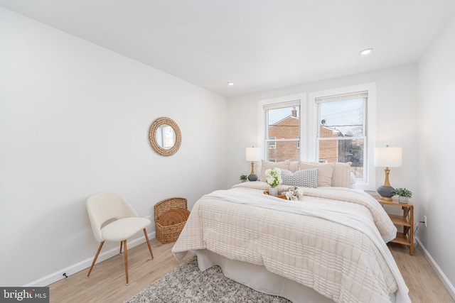 bedroom featuring recessed lighting, light wood-type flooring, and baseboards