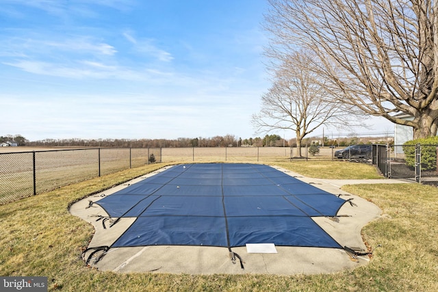 view of swimming pool with a yard, a fenced backyard, and a fenced in pool