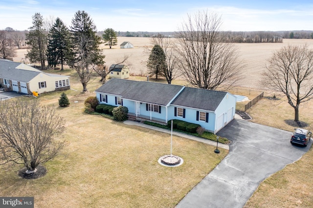 birds eye view of property featuring a rural view