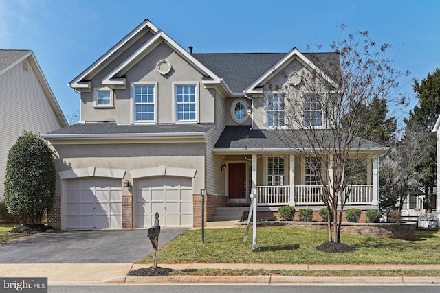 view of front of house with brick siding, a porch, stucco siding, a garage, and driveway