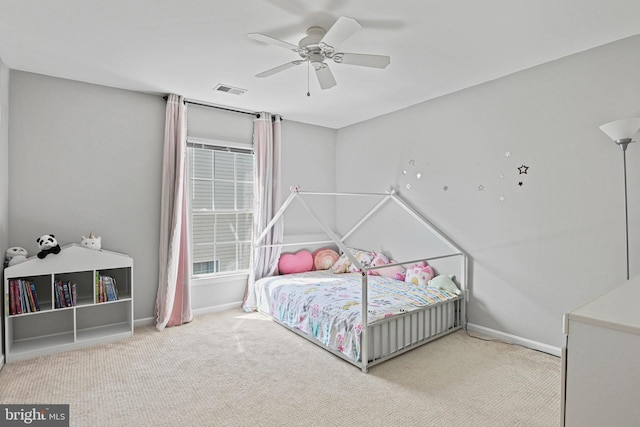 bedroom featuring carpet flooring, baseboards, visible vents, and a ceiling fan