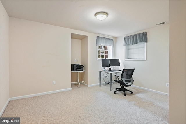 office with carpet flooring, baseboards, and visible vents