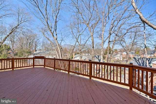 wooden terrace with a residential view