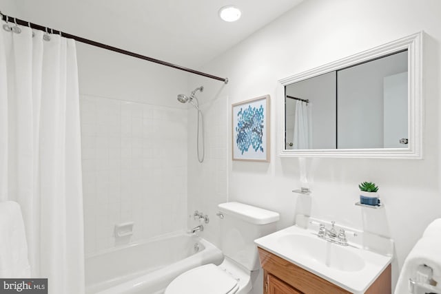 bathroom with toilet, shower / tub combo with curtain, and vanity