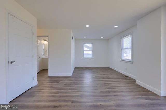 unfurnished bedroom with visible vents, recessed lighting, baseboards, and wood finished floors