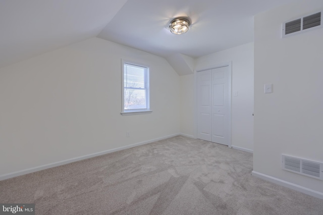 bonus room featuring visible vents, baseboards, lofted ceiling, and carpet