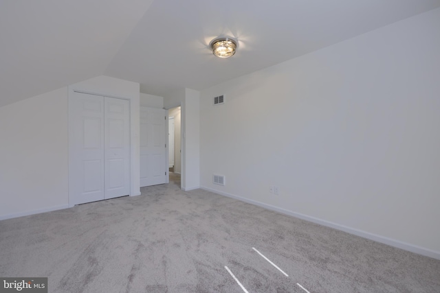 bonus room with carpet flooring, baseboards, and visible vents