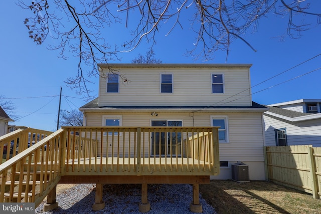 back of house featuring a deck, fence, and central AC