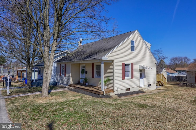 bungalow with entry steps, a front yard, and fence