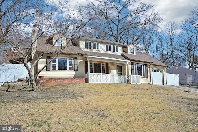 view of front of property featuring a porch, fence, a front yard, and a chimney