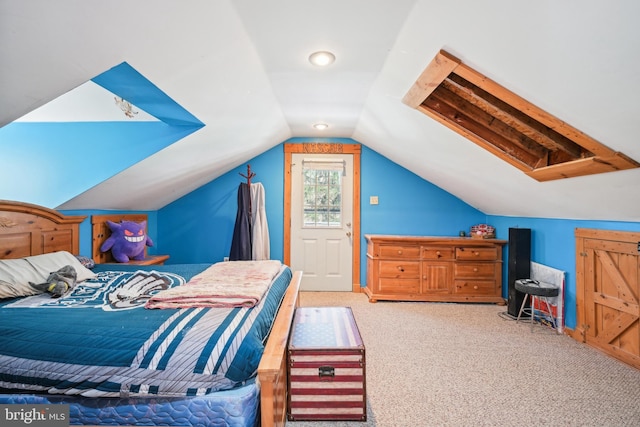 bedroom with carpet flooring and vaulted ceiling