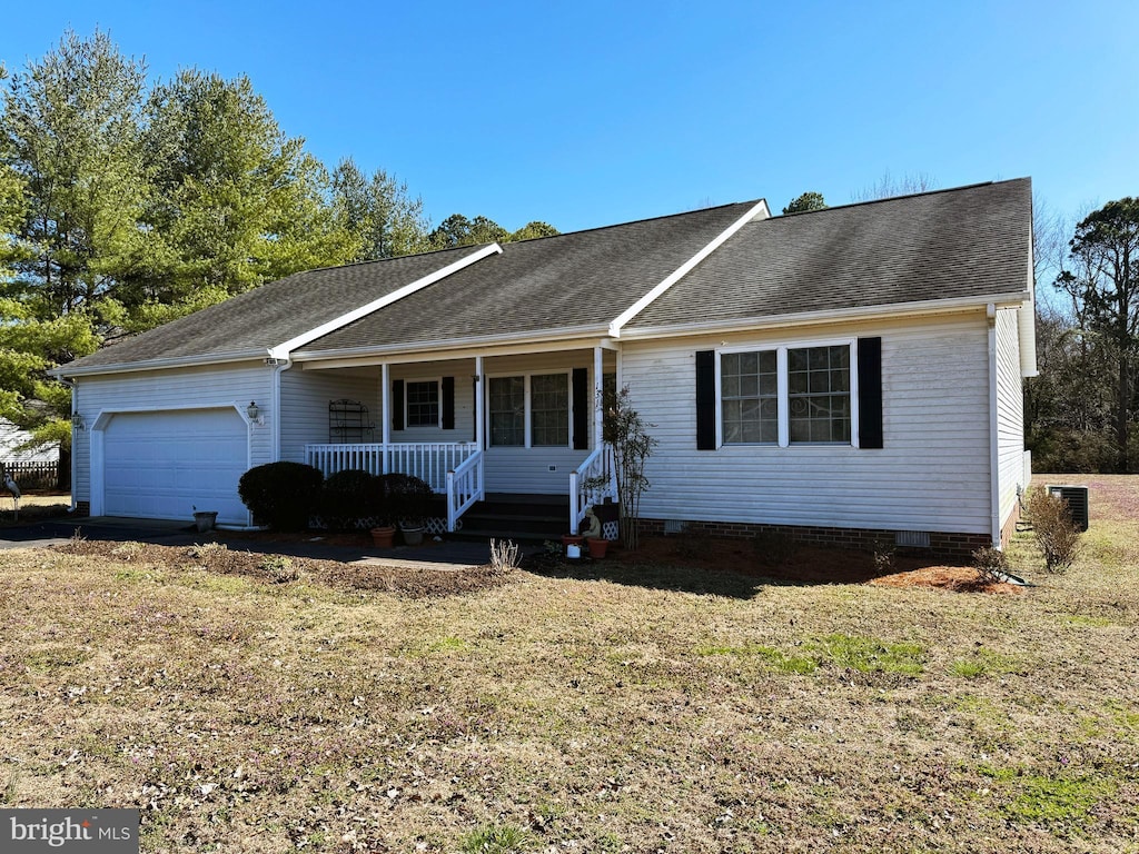 ranch-style house featuring an attached garage, covered porch, roof with shingles, and crawl space