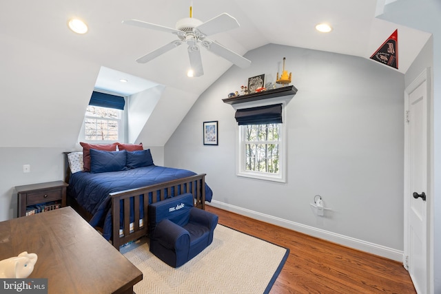 bedroom featuring baseboards, vaulted ceiling, recessed lighting, wood finished floors, and a ceiling fan