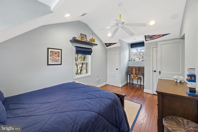 bedroom with wood finished floors, baseboards, visible vents, ceiling fan, and vaulted ceiling