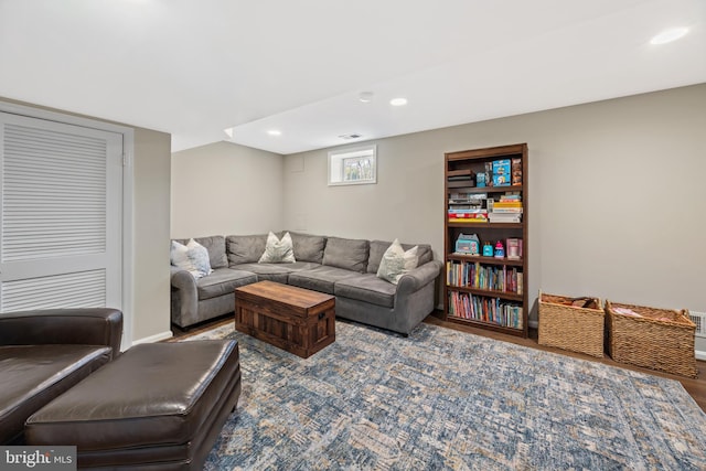 living room with recessed lighting, wood finished floors, and baseboards