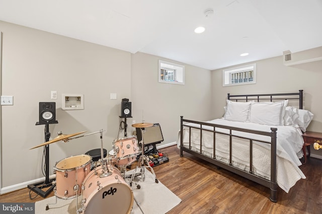 bedroom featuring recessed lighting, wood finished floors, and baseboards