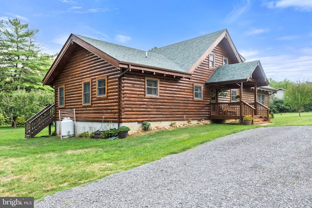 view of side of property with crawl space, log siding, a lawn, and a shingled roof