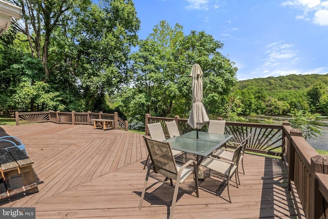 wooden deck with outdoor dining space