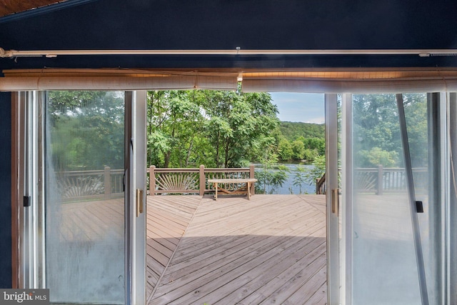 doorway to outside featuring a water view