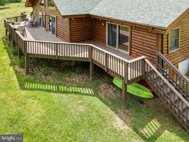 wooden deck with a lawn