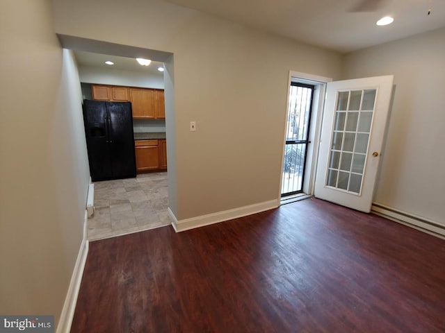 interior space featuring a ceiling fan, recessed lighting, light wood-style floors, and baseboards