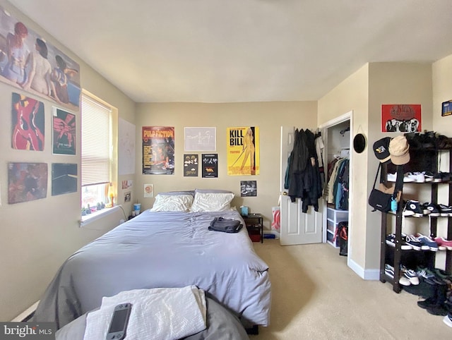 bedroom with baseboards and carpet flooring