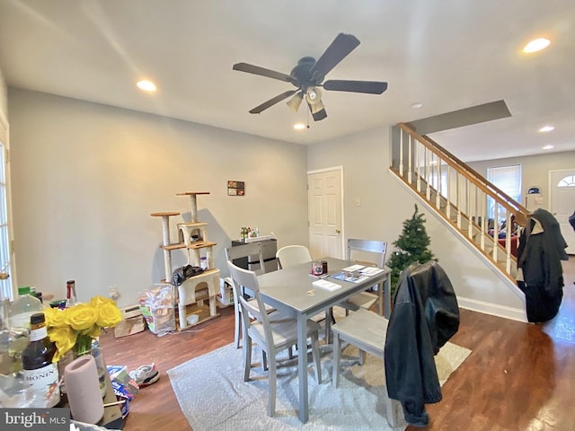 dining space with stairway, recessed lighting, baseboards, and wood finished floors